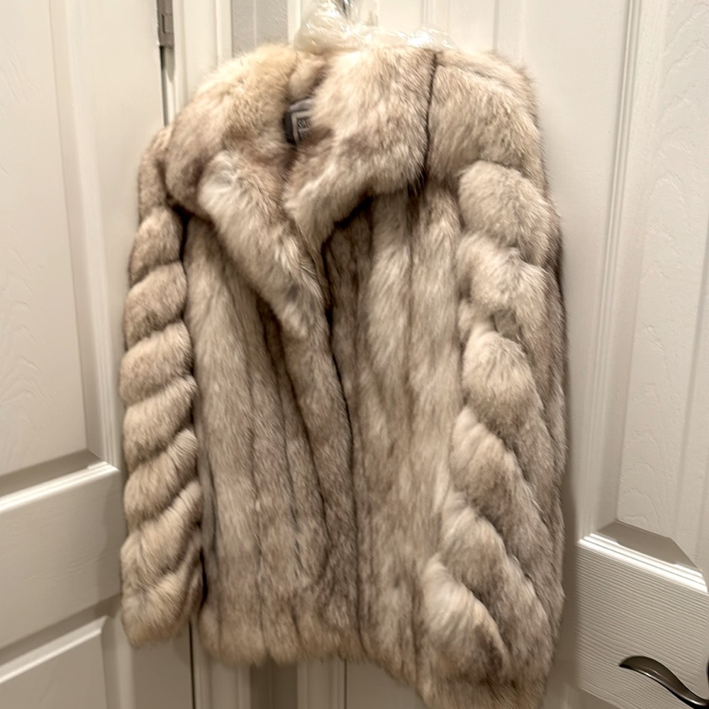 Saga-Fox fur coat. Fur coat light colored with some dark.